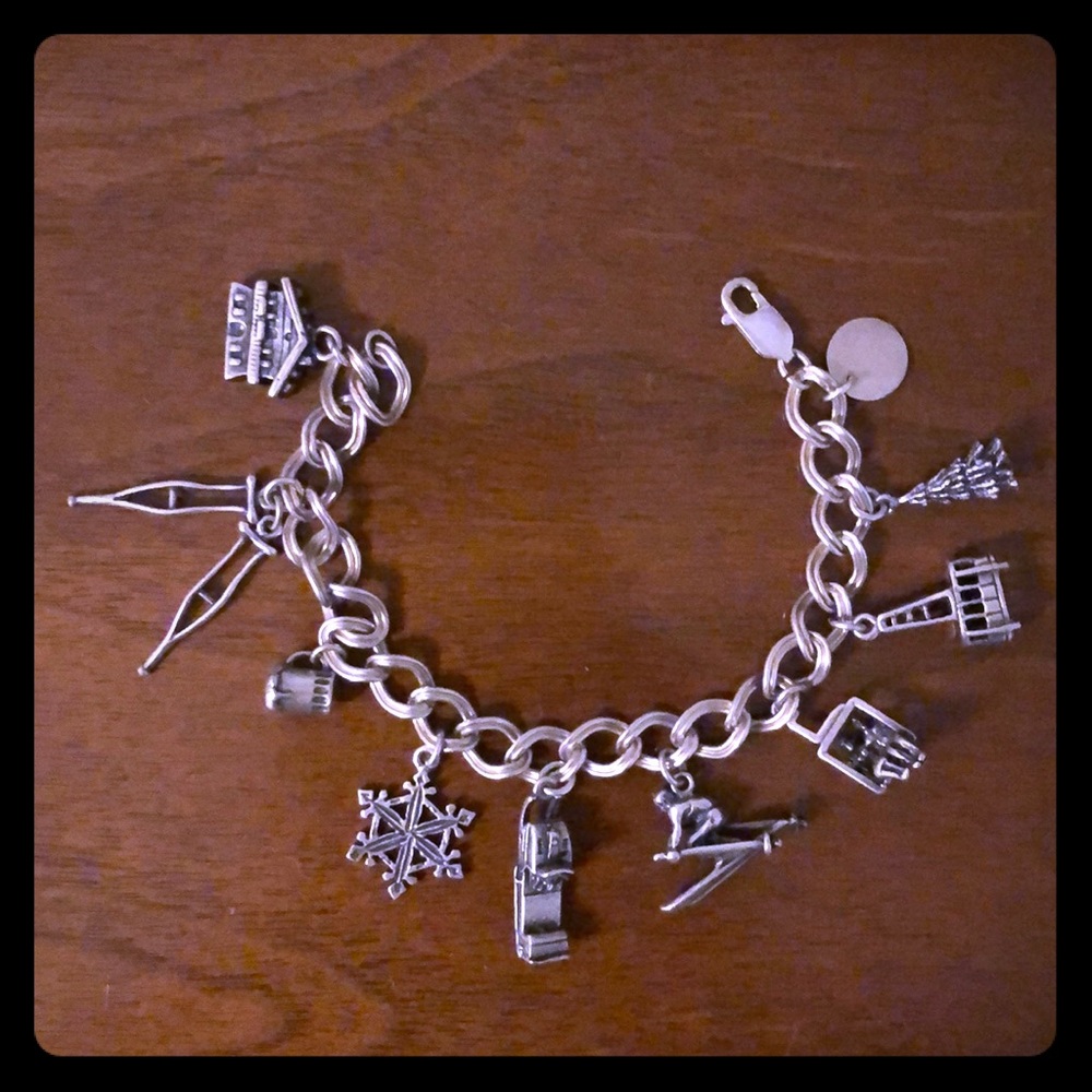 Sterling silver ski winter themed charm bracelet.